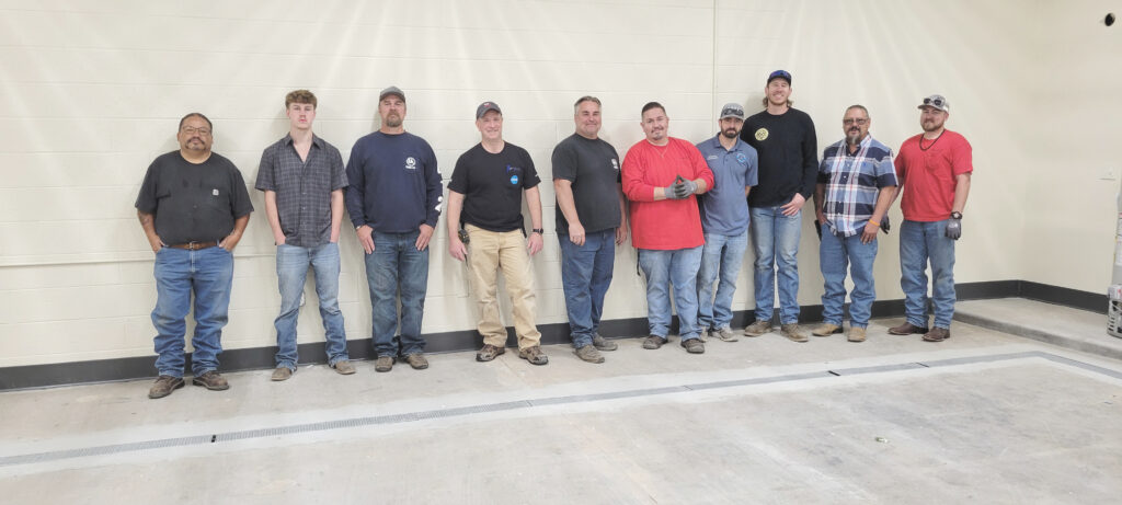 Local 412 members install plumbing training facility at Navajo Technical University